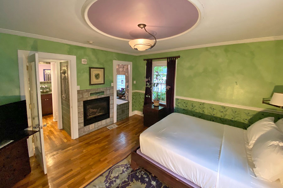 Spring Meadow Room bed and fireplace